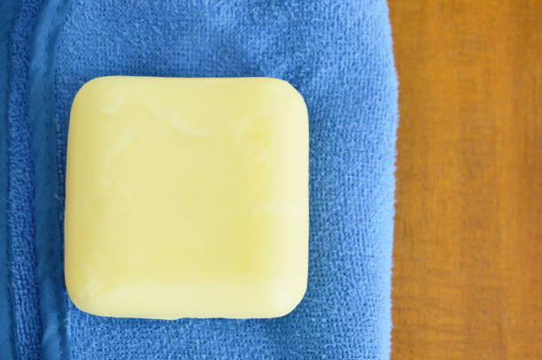 istock soap and towel on wooden table 868085938