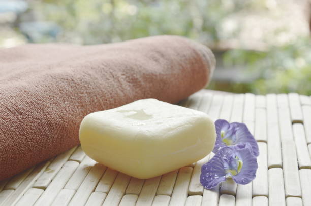 istock soap and towel with blue pea on bamboo mat 868086846
