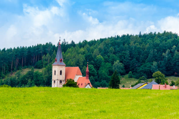 istock Nice medieval church behind meadow 868086952