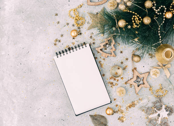 istock Christmas background with notebook in gold tone. Flat lay. Copy space 868086998