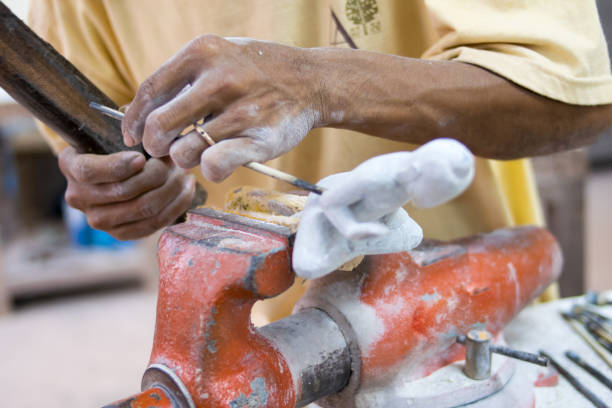 istock Craftsman carving a souvenir from wood 868087092