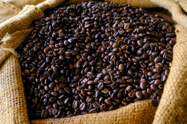 istock Coffee beans in coffee burlap bag 868087452
