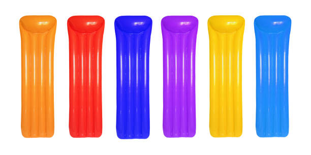 istock Multicolored inflatable floating pool raft mattress set isolated on white. 868088684