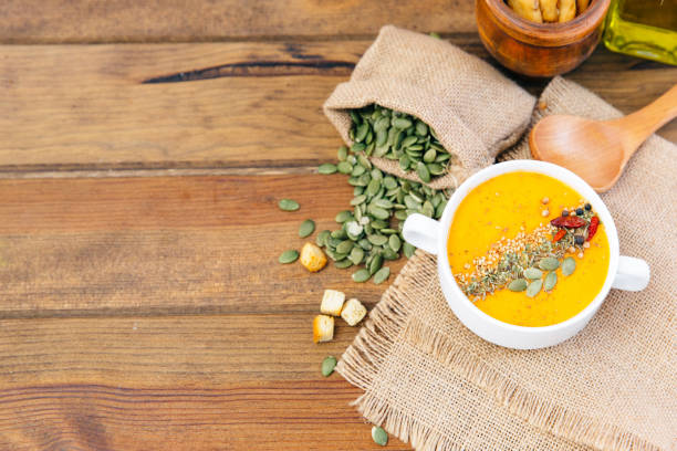 istock bowl of delicious pumpkin soup. Top view 868091164