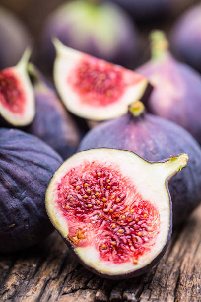 istock Figs. A few figs in a bowl on an old wooden background 868094138