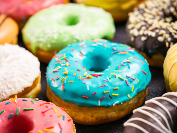 istock Close up view of assorted colorful donuts 868094226