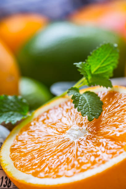 istock Citrus fresh fruit. Orange grapefruit lemon lime with mint leaves 868095210