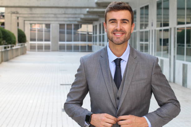 istock Gorgeous entrepreneur buttoning up his tailored suit 868095994