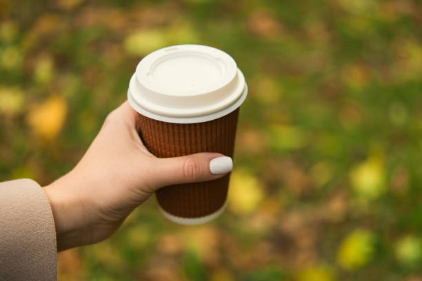 istock Woman drinking take away coffee cup 868098354