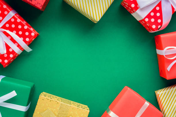 istock christmas and gift boxes on the green table 868098576