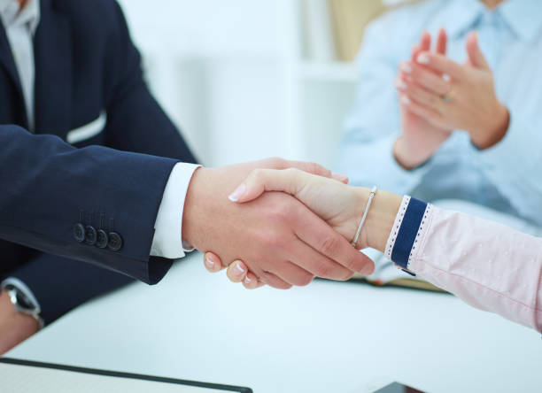 istock Business people shaking hands, finishing up a meeting. 868102754