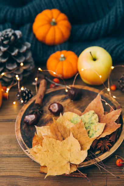 istock Autumn composition over wooden background. Apples, pumpkin and leaves 868106302