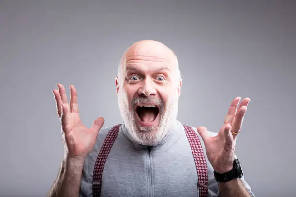 Photo of exaggerated surprise of an old man