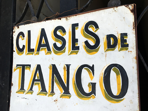 Closeup view of sign offering tango lessons in Buenos Aires, Argentina