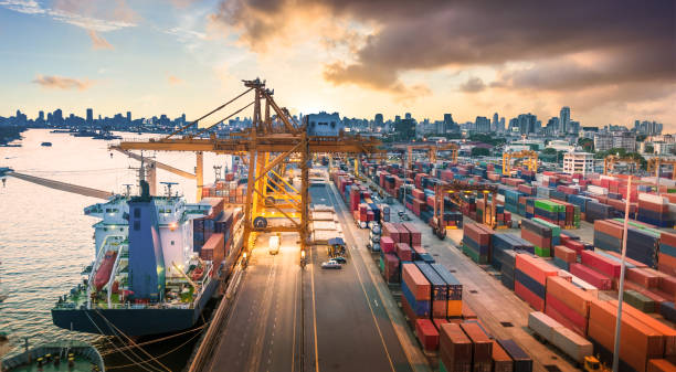 istock Logistics and transportation of Container Cargo ship and Cargo working crane bridge in shipyard 868113040
