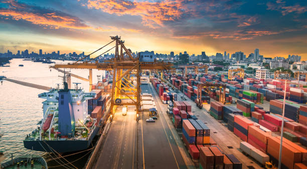 istock Logistics and transportation of Container Cargo ship and Cargo working crane bridge in shipyard 868113074