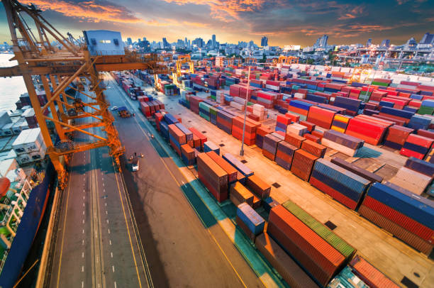 istock Logistics and transportation of Container Cargo ship and Cargo working crane bridge in shipyard 868113096