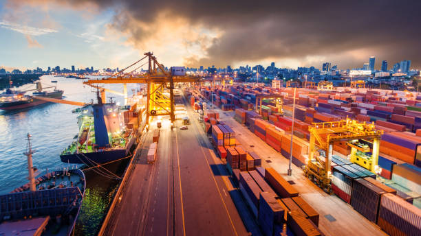 istock Logistics and transportation of Container Cargo ship and Cargo working crane bridge in shipyard 868113100