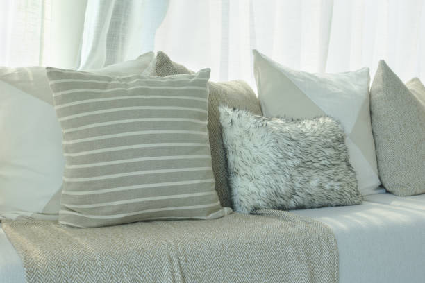 istock Brown color scheme pillows setting on sofa in living room 868113658