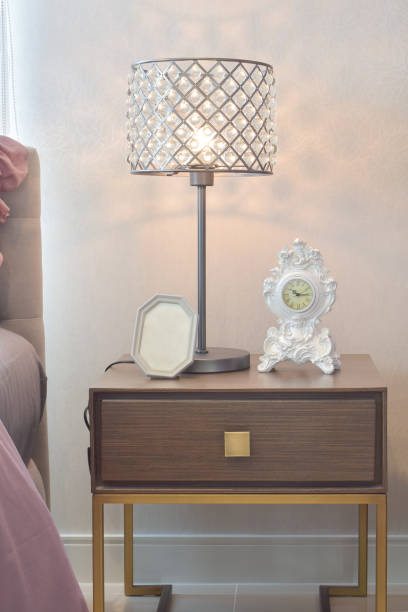 istock Cozy  and classic  bedroom interior with pillows and reading lamp on bedside table 868117588