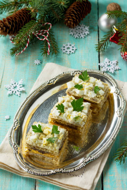 istock Home holiday snacks Christmas table. Snack cake with a cracker, herring pate, mushroom pate and cheese sauce. 868120750