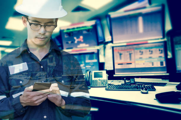 istock Double exposure of  Engineer or Technician man in working shirt  working with smart phone in control room of oil and gas platform or plant industrial for monitor process, business and industry concept. 868120776