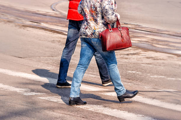 istock crossroad with walking pedestrians 868128562