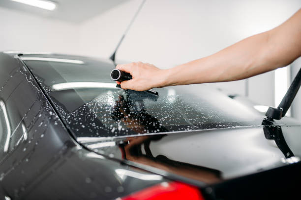 istock Specialist work, car tinting film installation 868129730