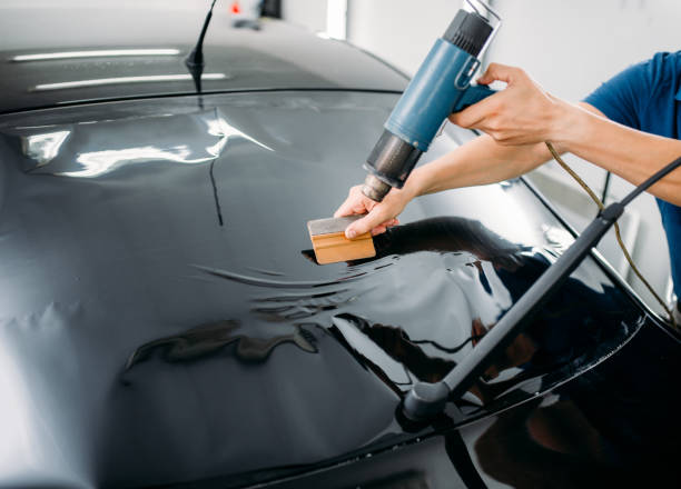 istock Specialist with drier, tinting film installation 868129986