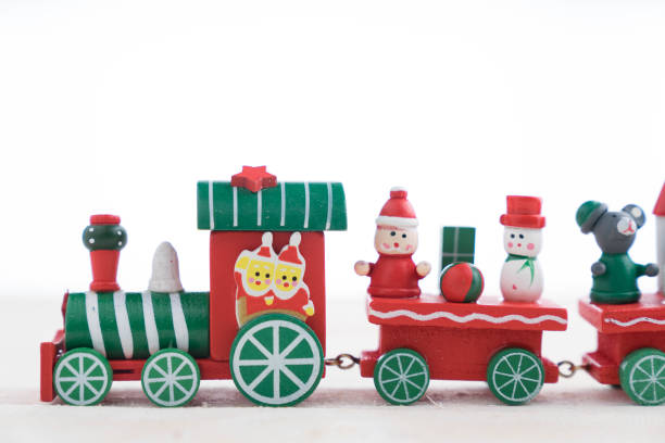 istock toy train on wooden background for christmas 868130114