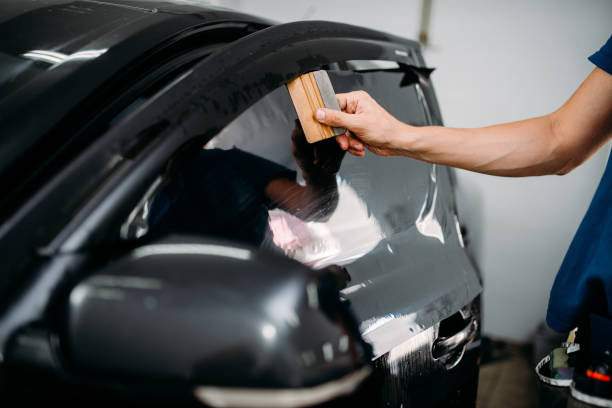istock Specialist with drier, tinting film installation 868132864