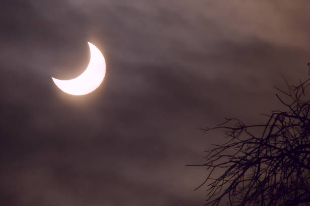istock Partial Solar Eclipse Januart 4th, 2011 in Moscow (Russia). The sun partially covered by the Moon disk is visible through the clouds. 868152942