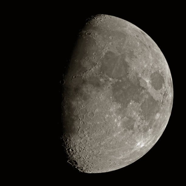 istock Close up of a first quarter moon (half moon) with different details on its surface (craters, mountains, etc.) visible. 868152976