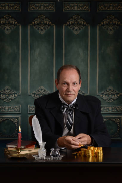 istock happy victorian miser counting his money 868156118