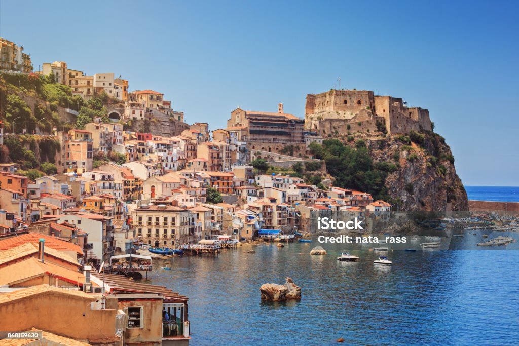 Chianalea of Scyila Scilla castle Ruffo, and harbor with fishing boats in Calabria, southern Italy. Calabria Stock Photo