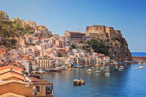 Chianalea of Scyila Scilla castle Ruffo, and harbor with fishing boats in Calabria, southern Italy. ionian sea photos stock pictures, royalty-free photos & images