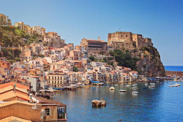 Chianalea of Scyila Scilla castle Ruffo, and harbor with fishing boats in Calabria, southern Italy. castle scilla stock pictures, royalty-free photos & images