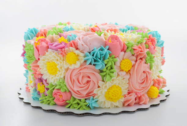 istock Cake with color cream flowers on white background. 868162416