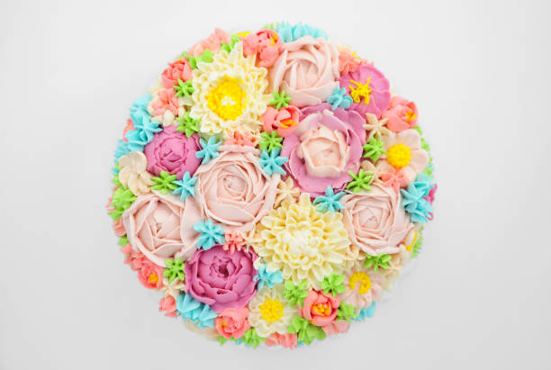 흰색 바탕에 크림 색 꽃 케이크입니다. - icing cake multi colored weddings 뉴스 사진 이미지
