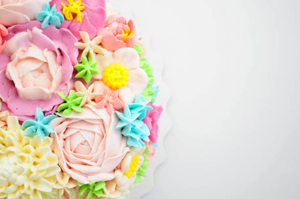 istock Cake with color cream flowers on white background. 868162428