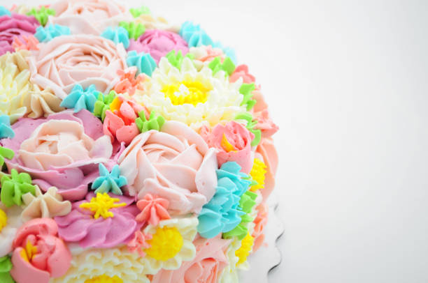 istock Cake with color cream flowers on white background. 868162444
