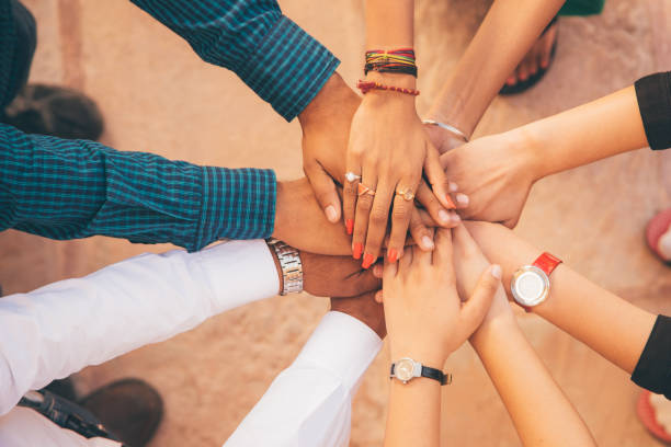 istock Indian Friends With Their Hands Together 868162580