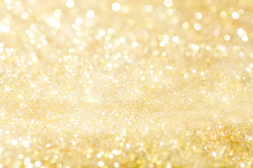 Golden holiday background bokeh. Abstract background. Happy New year. Merry Christmas.