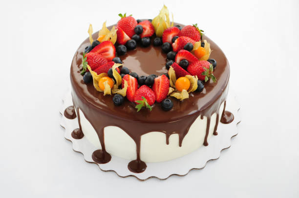 istock Cake in chocolate with strawberries, blueberries and physalis. 868176894