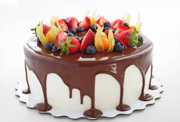 istock Cake in chocolate with strawberries, blueberries and physalis. 868176900