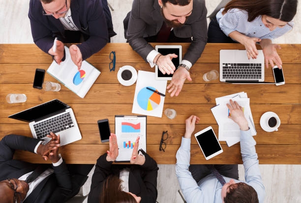 istock Satisfied multiethnic busy business people clapping hands cheering successful reporter in office, top view 868177826
