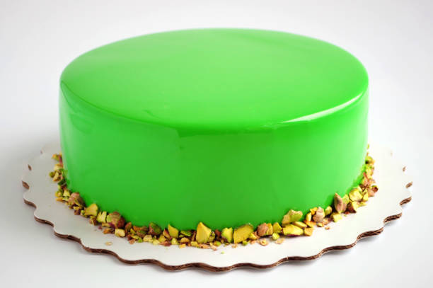 istock Mousse cake with green mirror glaze. 868180690