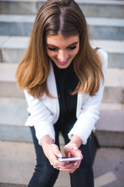 istock Woman using smart phone in the city 868181218