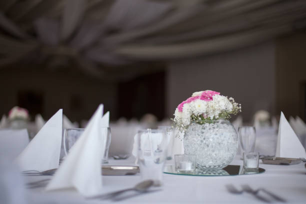 istock Beautiful vase with flower decoration on restaurant's dining table 868184226