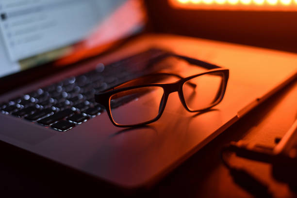 istock Glasses and a laptop on the table 868184276